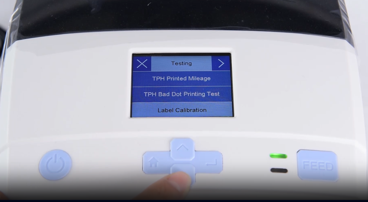 ए close-up of a machine's digital interface showing a testing menu.